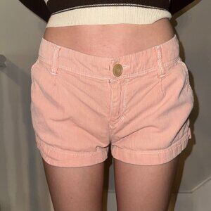 Low-rise stripped American Eagle shorts.